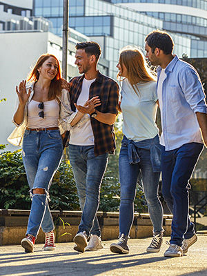 A group of friends walking across the town square feeling safe